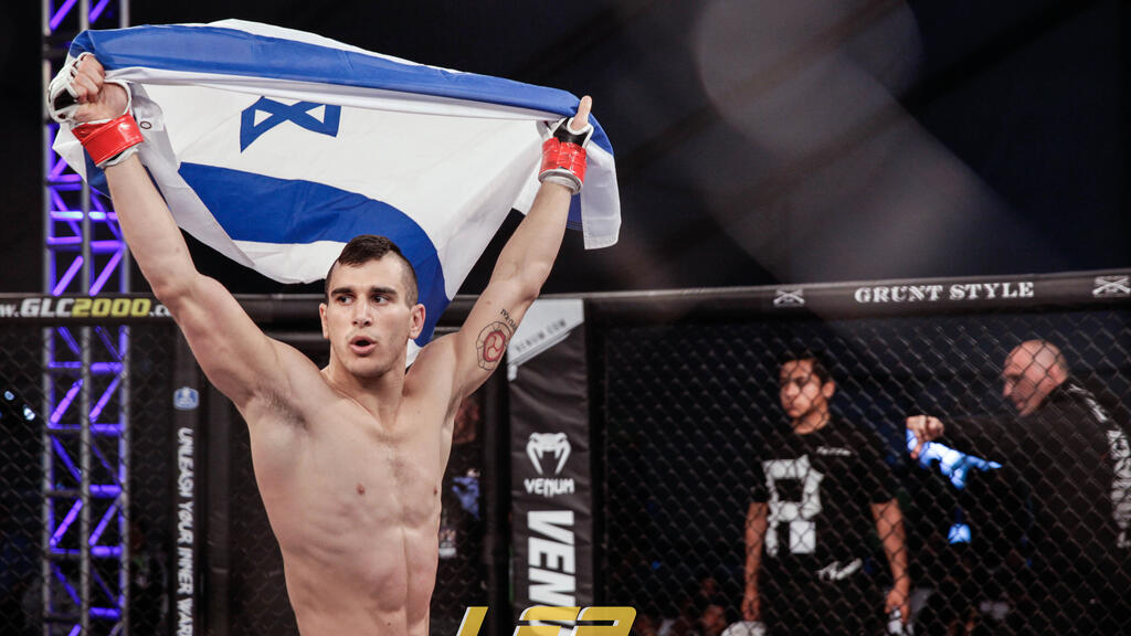 Natan Levy with Israeli flag (Photo: Amy Kaplan) נתן לוי