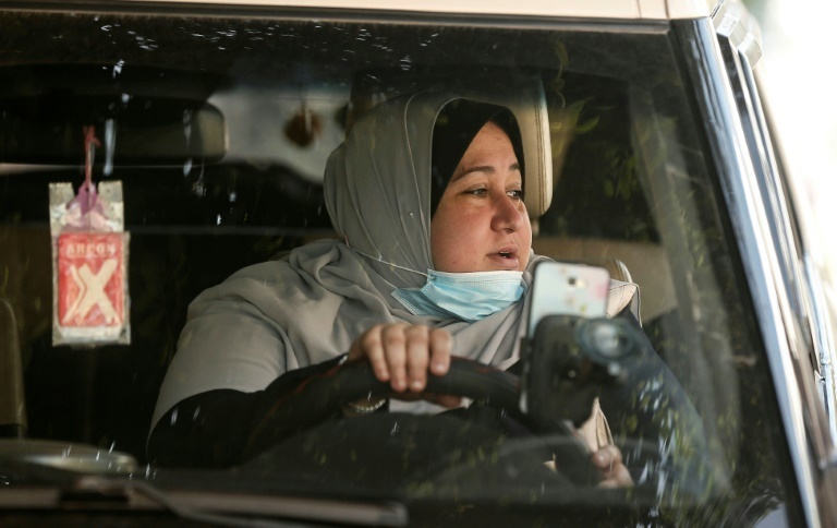 The first female Palestinian taxi driver in the Gaza Strip, Nayla Abu Jubbah,