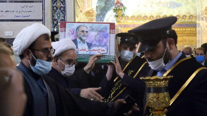 the coffin of Iranian nuclear scientist Mohsen Fakhrizadeh carried inside the Shrine of Masoumeh, during a funeral ceremony in the city of Qom