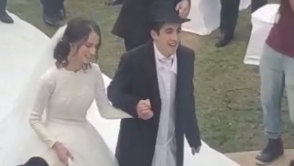 The bride and groom at the UAE's first Orthodox Jewish wedding 
