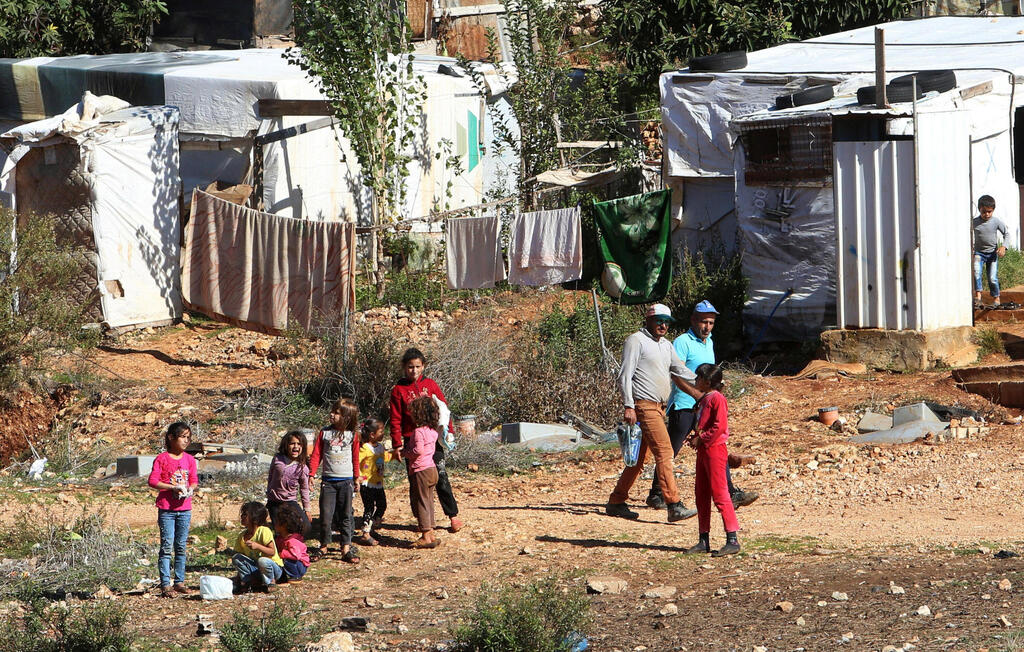Syrian refugees are pictured at a refugee camp in Marjayoun, southern Lebanon 