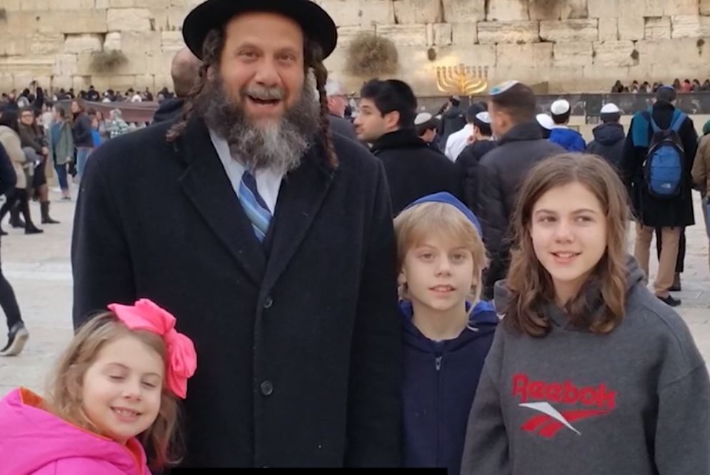 David Walk with his children at the Western Wall in Jerusalem 