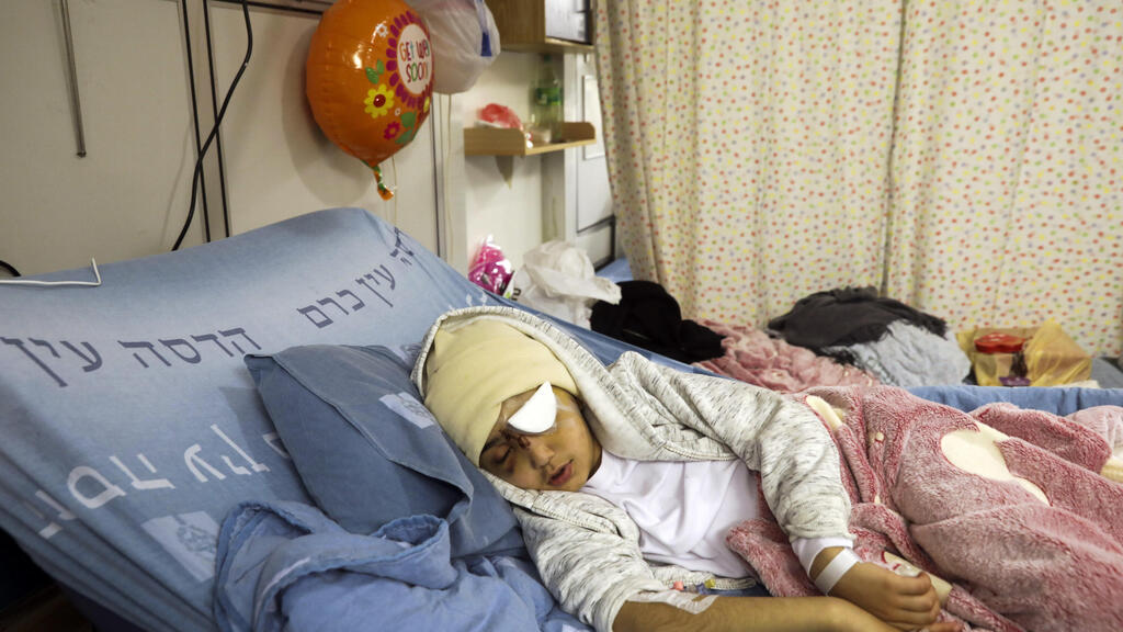  9-year-old Palestinian boy Malik Eissa rests in Hadassa hospital in Jerusalem