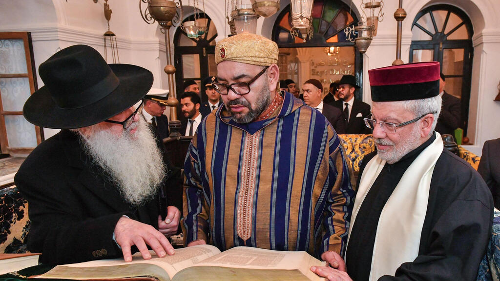 King Mohammed VI (C) during a visit to the "Bayt Dakira" (House of Memory) museum, in the Atlantic coastal city of Essaouira 