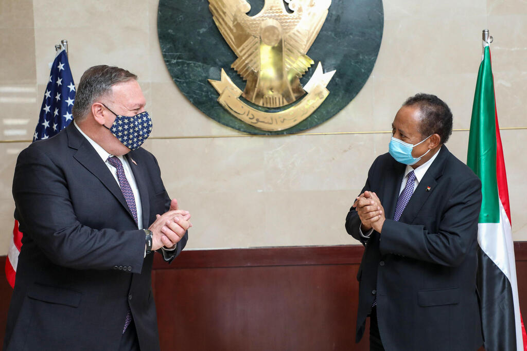 Sudan's Prime Ministers office on August 25, 2020, US Secretary of State Mike Pompeo (L) greets Sudanese Prime Minister Abdalla Hamdok (R) in Khartoum 