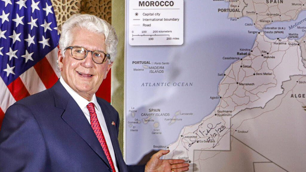 David T. Fischer, US Ambassador to the Kingdom of Morocco, stands before a US State Department-authorised map of Morocco recognising the internationally-disputed territory of the Western Sahara 