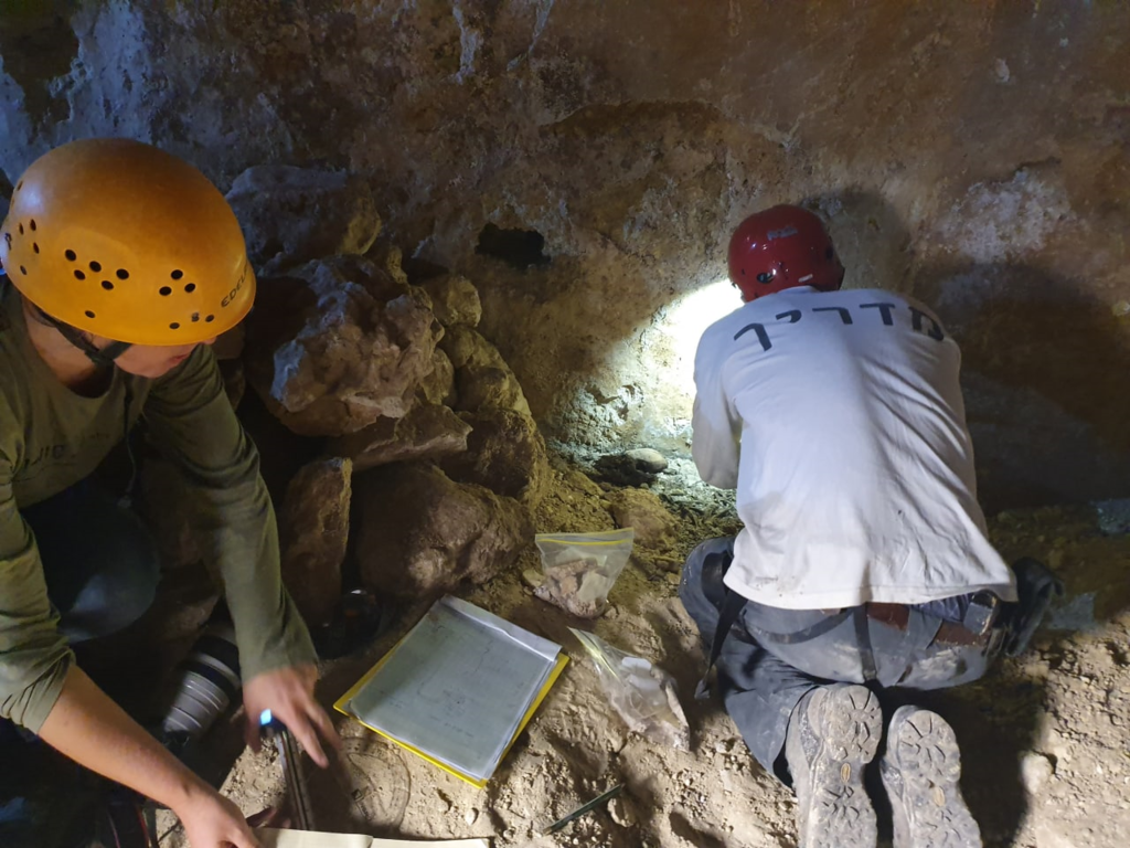 Recording measurements of the ancient cistern from the Hasmonaean period 