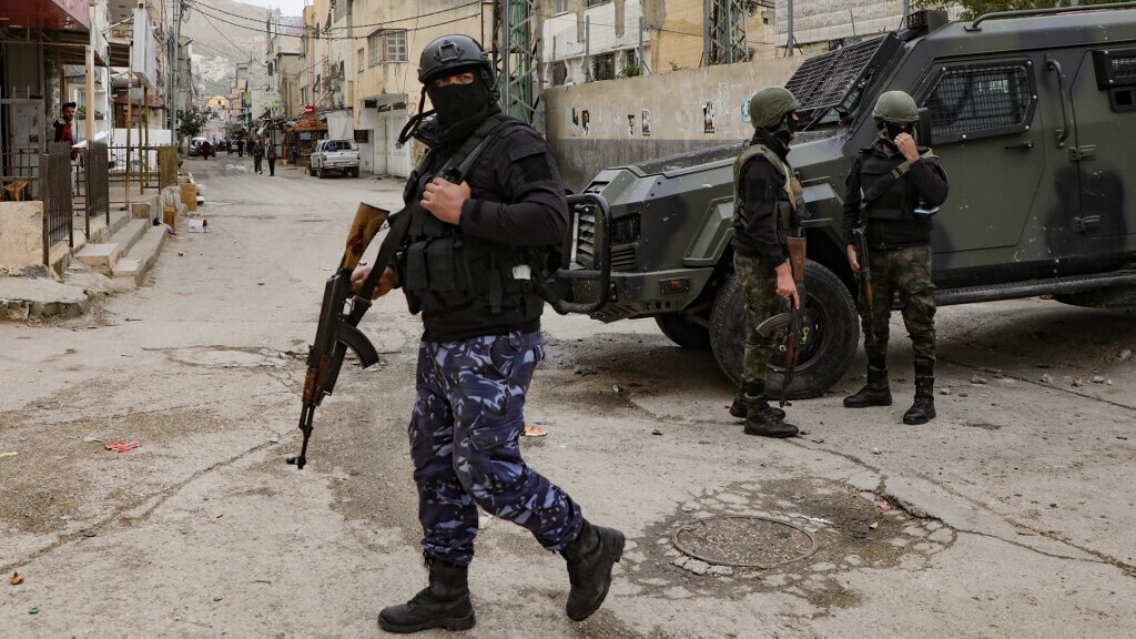 Palestinian Authority security forces near the West Bank city of Nablus (Photo: AFP) Palestinian Authority security forces in balaclavas stand by an armored vehicle at the entrance to Balata camp, near the West Bank city of Nablus