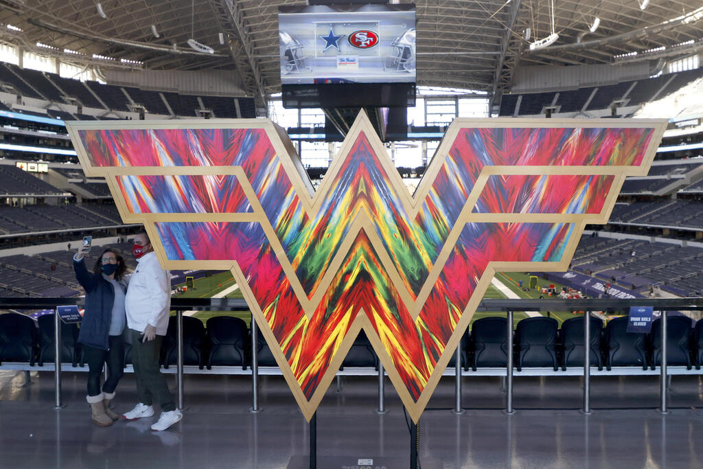  the "Wonder Woman" logo on the main concourse of AT&T Stadium