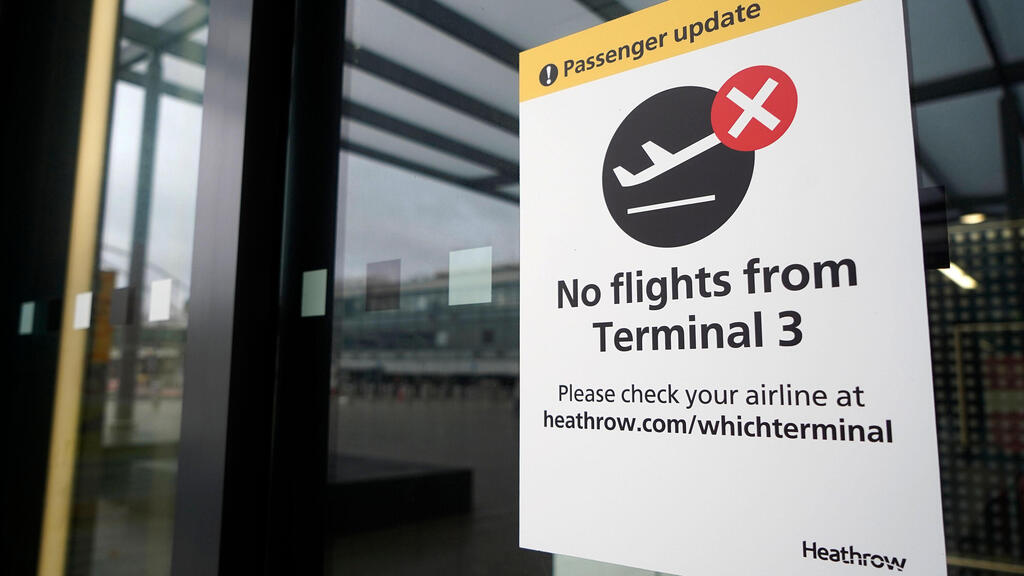 A sign alerts travels to the closure of Terminal 3 at Heathrow Airport in west London on December 21, 2020, as a string of countries around the world banned travellers arriving from the UK