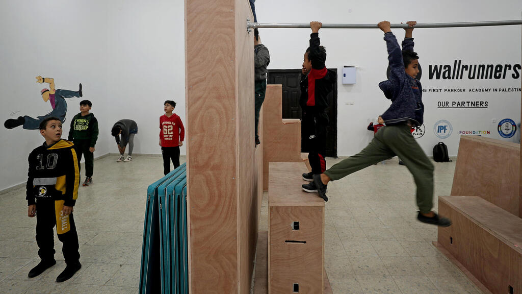 Palestinian Parkour enthusiasts exercise in a training facility in Gaza City 