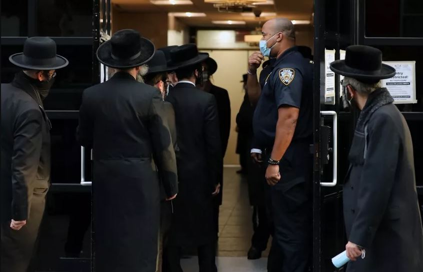 People gather outside of the Congregation Yetev Lev D'Satmar synagogue in the Williamsburg neighborhood in the Brooklyn borough of New York City, October 2020 