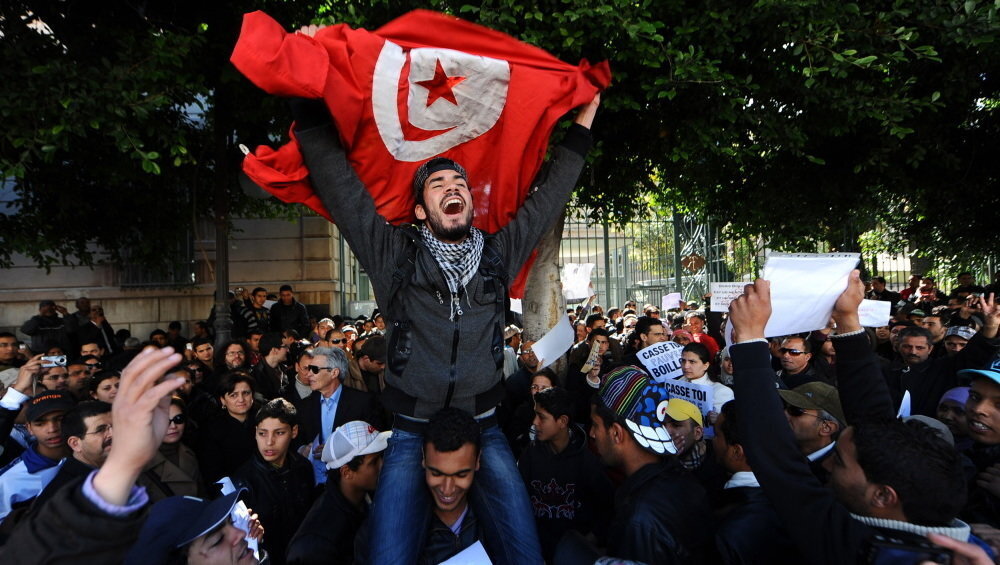Demonstrators outside the French embassy in Tunis after a fruit vendor set himself on fire in 2011