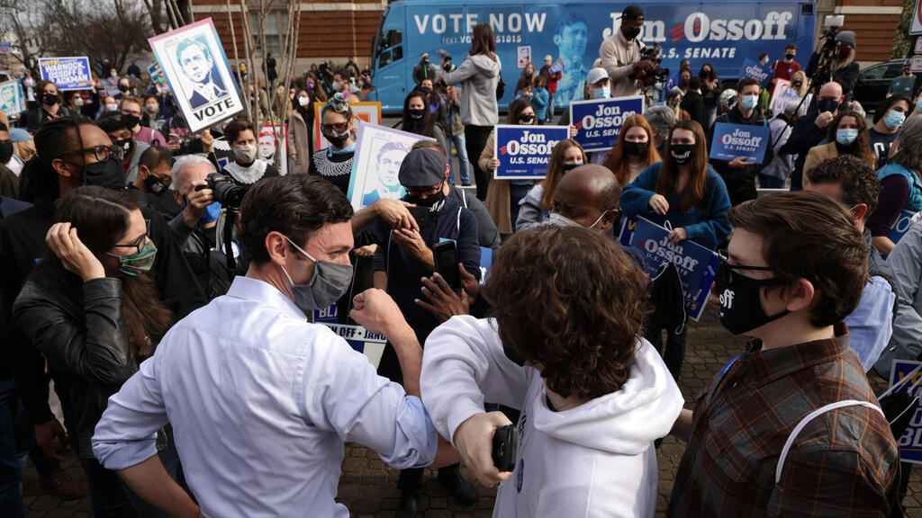  Democratic U.S. Senate candidate Jon Ossoff greets a supporter during a campaign 