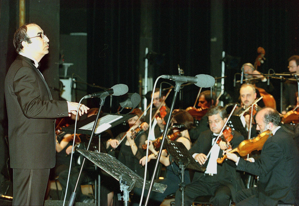 Lebanese maestro Elias Rahbani conducts his orchestra during a concert at the Casino du Liban 