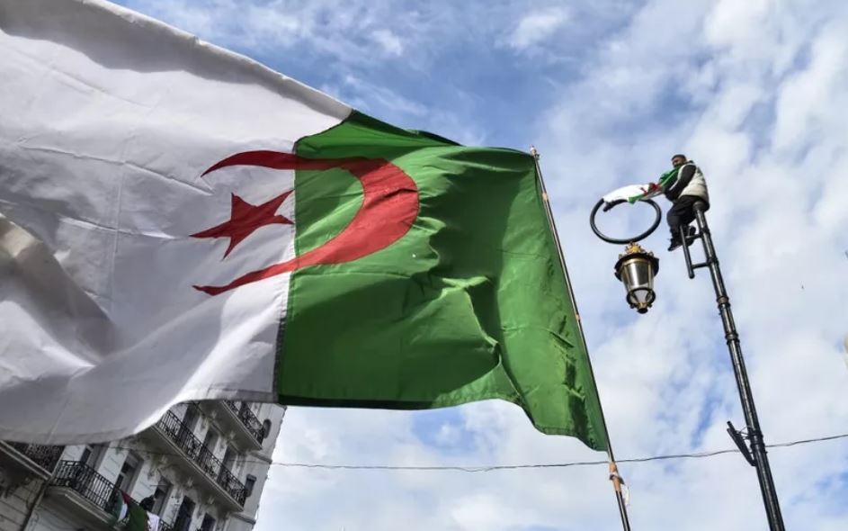  an Algerian national flag flying during a demonstration against ailing President Abdelaziz Bouteflika in the capital Algiers