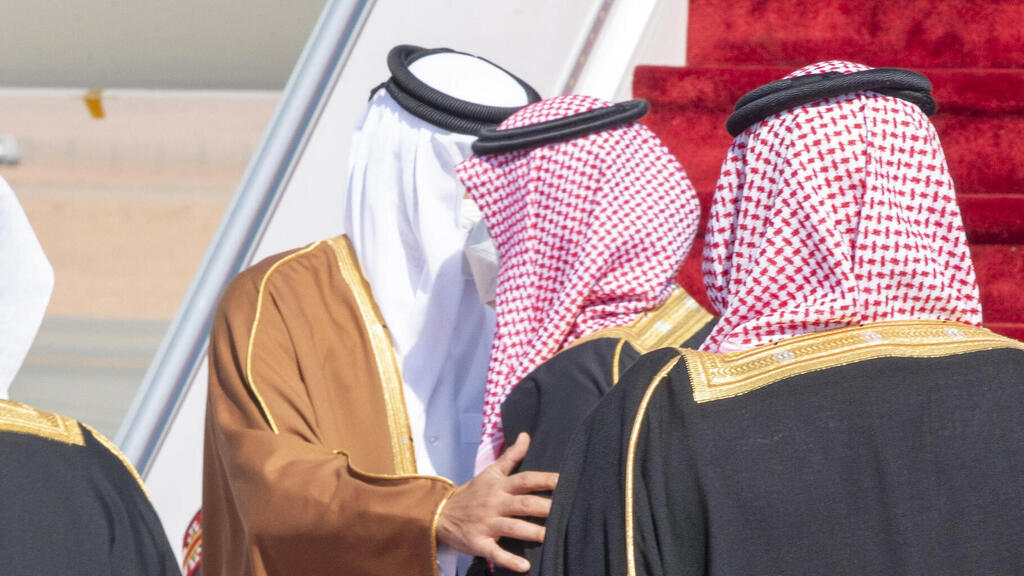 Saudi Crown Prince Mohammed bin Salman welcomes Qatar's Emir Tamim bin Hamad bin Khalifa Al-Thani upon his arrival for a Gulf Cooperation Council summit in Al-Ula, January 5, 2021 