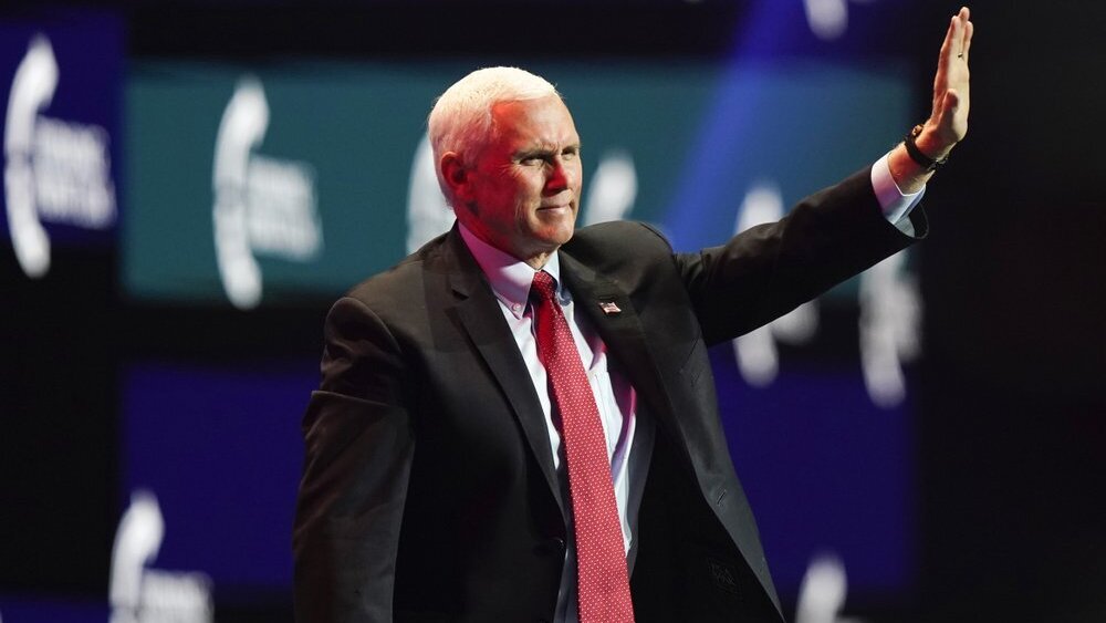 Vice President Mike Pence waves as he walks off the stage after speaking at the Turning Point USA Student Action Summit, Tuesday, Dec. 22, 2020, in West Palm Beach, Fla. 