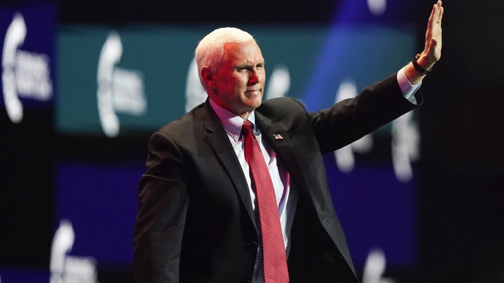 Vice President Mike Pence waves as he walks off the stage after speaking at the Turning Point USA Student Action Summit, Tuesday, Dec. 22, 2020, in West Palm Beach, Fla. 