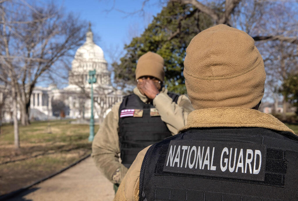 National Guard guardsmen stand outside the U.S. Capitol 