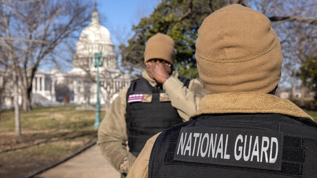 National Guard guardsmen stand outside the U.S. Capitol 
