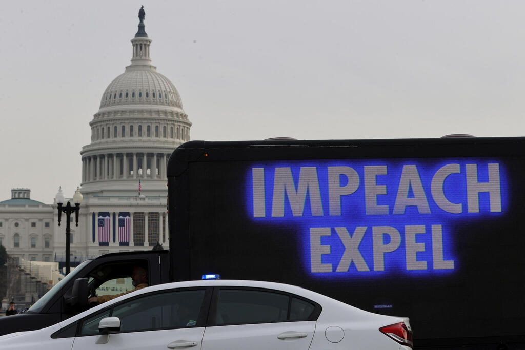 A demonstrator sits in a truck with a video screen near the U.S. Capitol in Washington,