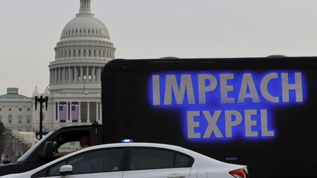 A demonstrator sits in a truck with a video screen near the U.S. Capitol in Washington,
