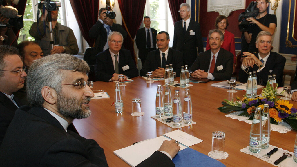 The Iranian and American representatives Saeed Jalili, left, and William J. Burns, third from right, in Geneva 
