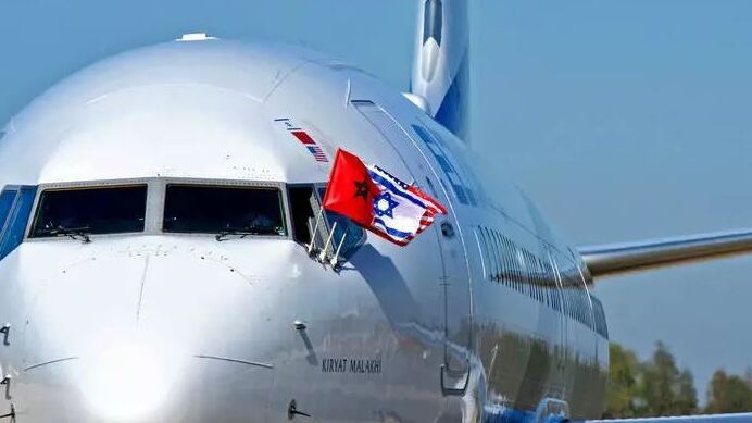 The Moroccan, Israeli and U.S. flags fly from the cockpit of an El Al plane in Rabat after the first direct Israel-Morocco commercial flight (Photo: AFP) The flags of Morocco, Israel, and the United States flutter from the cockpit of an El Al airplane that landed in Morocco's capital Rabat for the first Israel-Morocco direct commercial flight