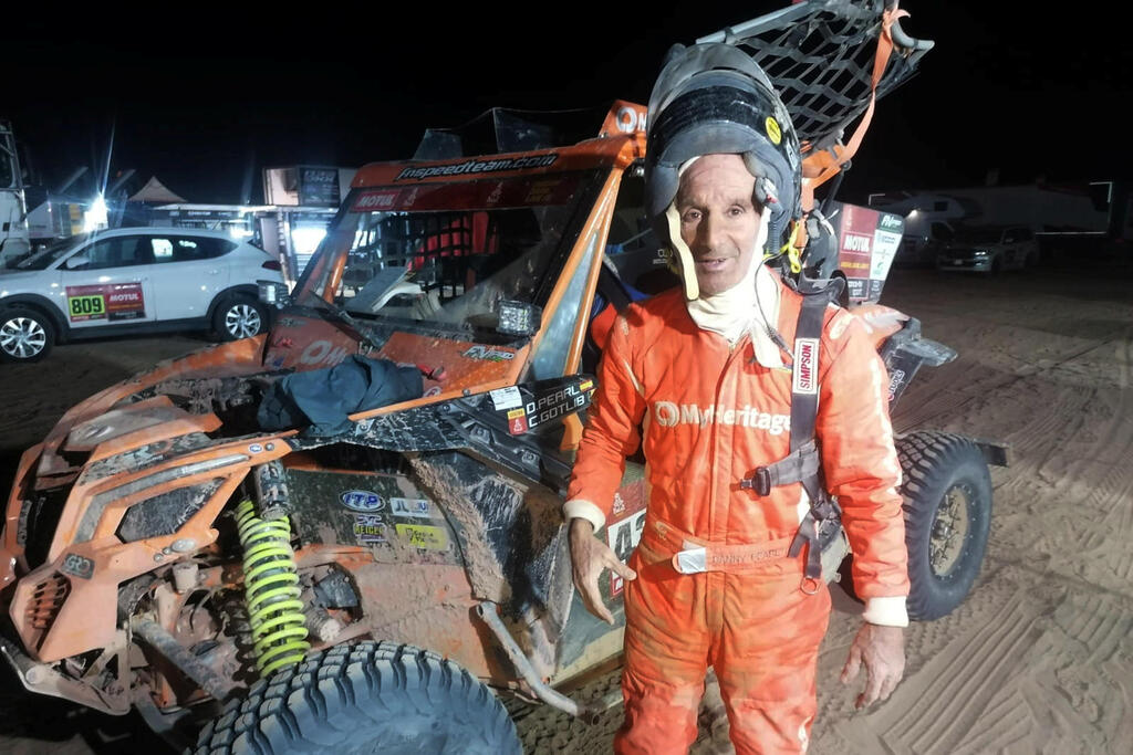Driver Danny Pearl stands by his Lightweight Vehicle Prototype, operated by Israelis, as he takes part in the Dakar Rally, Saudi Arabia 