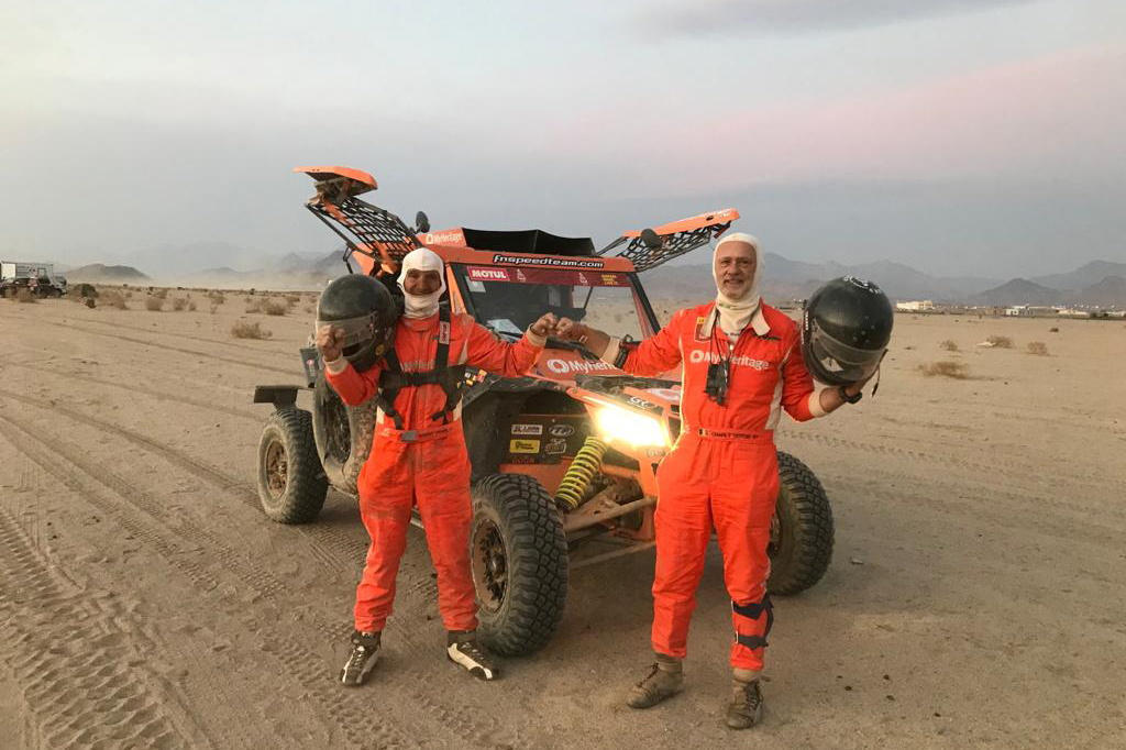 Driver Danny Pearl and co-driver Charly Gotlib, stand by their Lightweight Vehicle Prototype, as they take part in the Dakar Rally, Saudi Arabia 