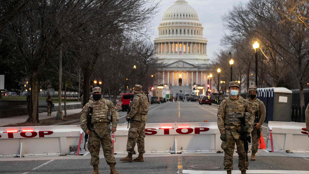  Members of the U.S. National Guard stand watch at the US Capitol in Washington