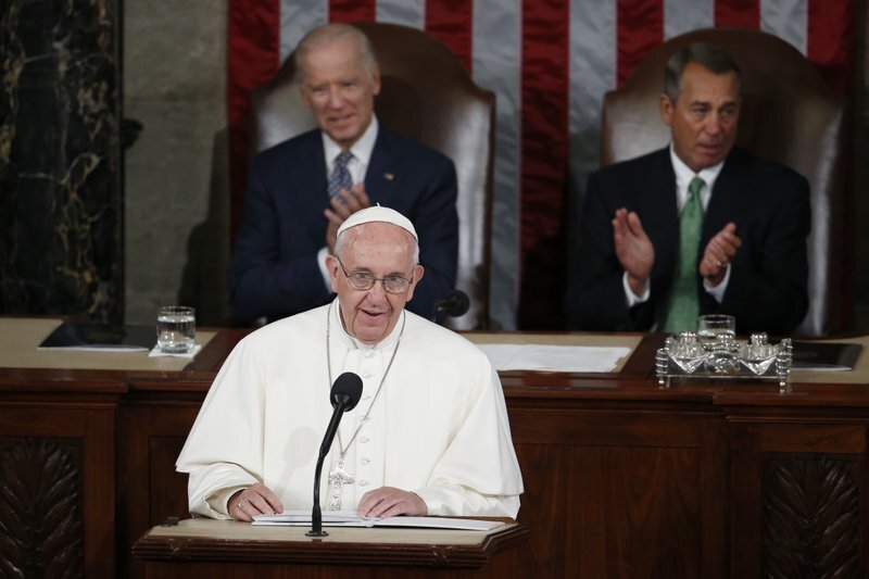Then-Vice President Joe Biden watches as Pope Francis addresses a joint meeting of the U.S. Congress on Capitol Hill in 2015 