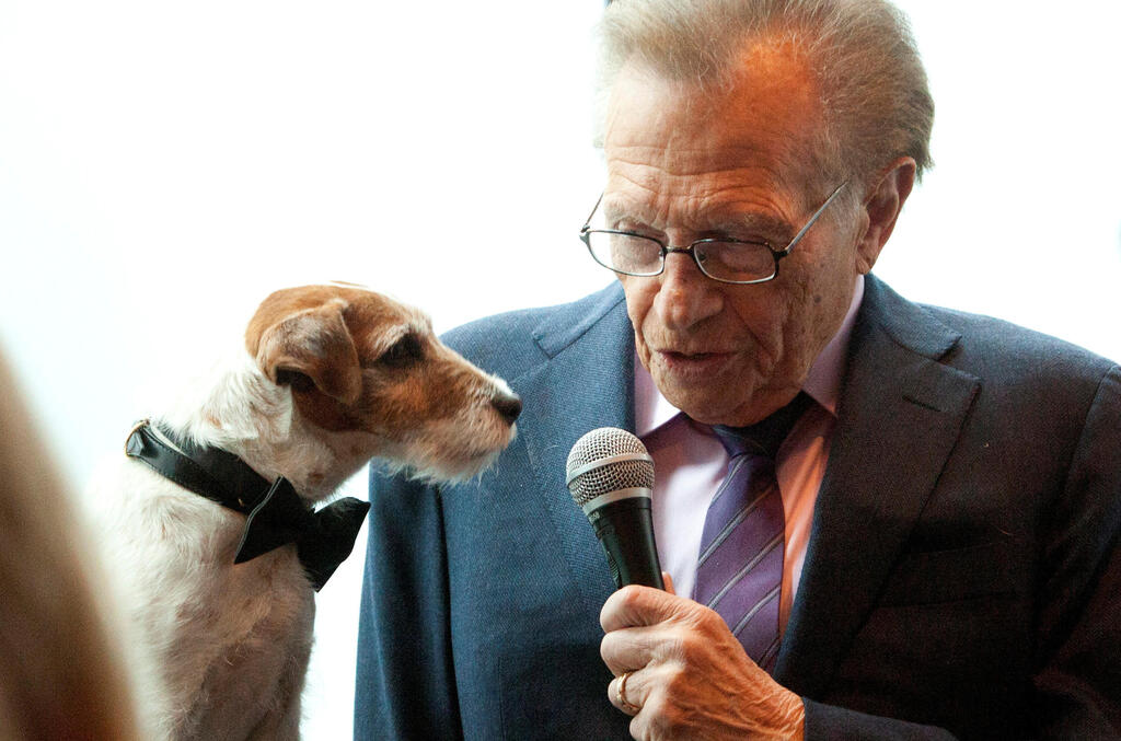 Larry King interviews Uggie, the dog from the film 'The Artist, in New York, May 2012 