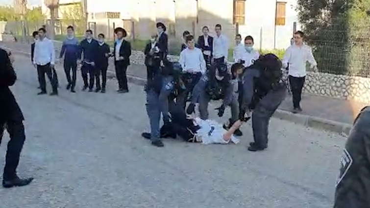 ultra-Orthodox clash with police outside a religious seminary in Ashdod operating in violation of coronavirus lockdown restrictions 