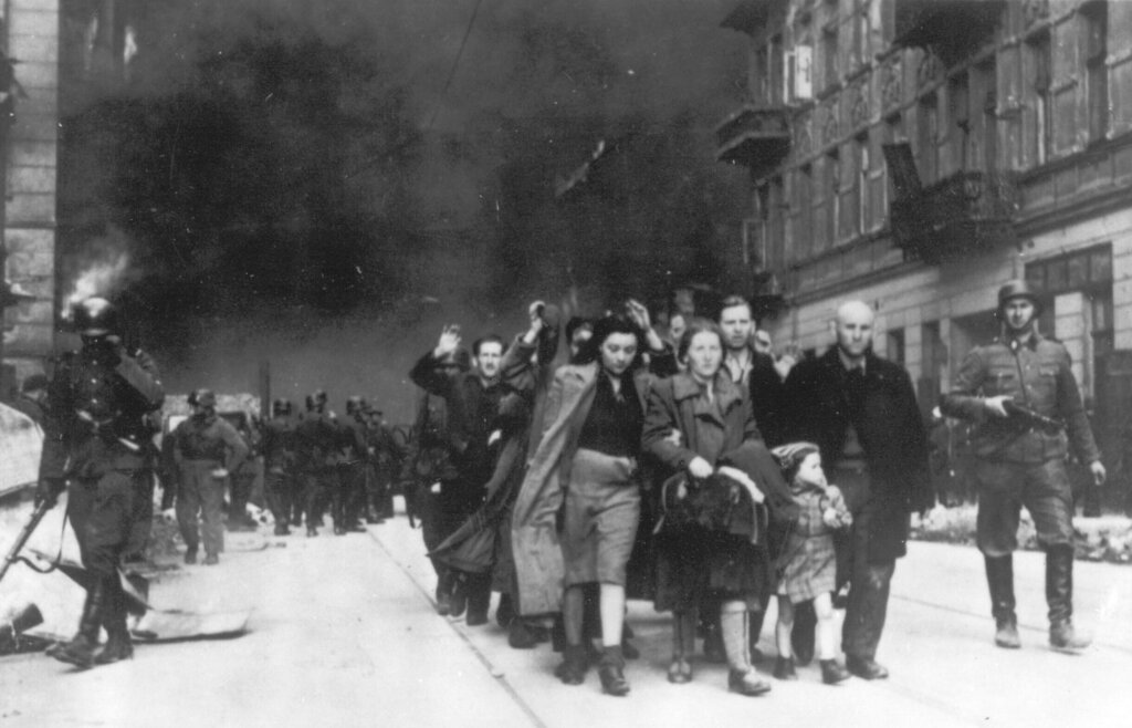 A group of Polish Jews are led to deportation by German SS troops