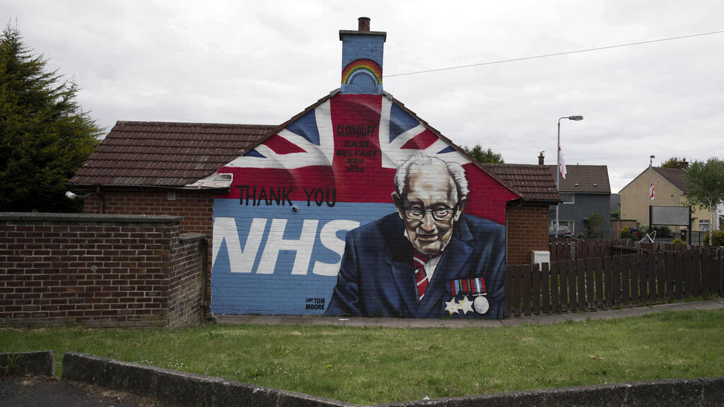 A mural depicting 100 year old army veteran and NHS fund raiser Captain Tom Moore