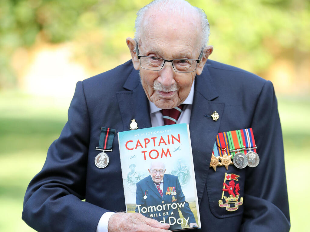 Captain Sir Tom Moore poses during a photocall to mark the launch of his memoir 'Tomorrow Will Be A Good Day' at The Coach House in Milton Keynes, Sept. 2020 