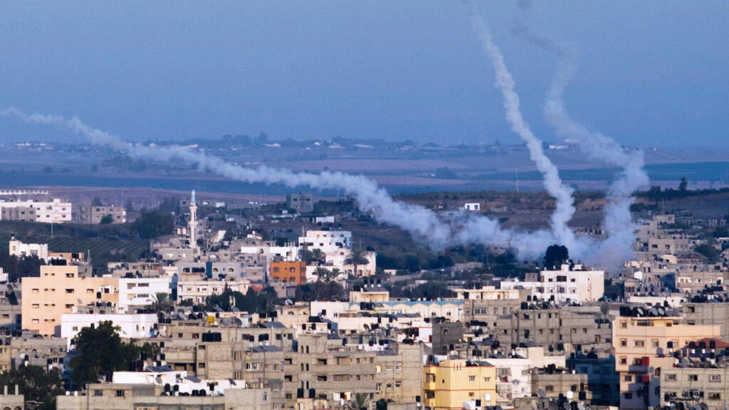 In this file photo taken on August 21, 2014 smoke trails mark the path of Palestinian missiles fired from the north-east of Gaza City 