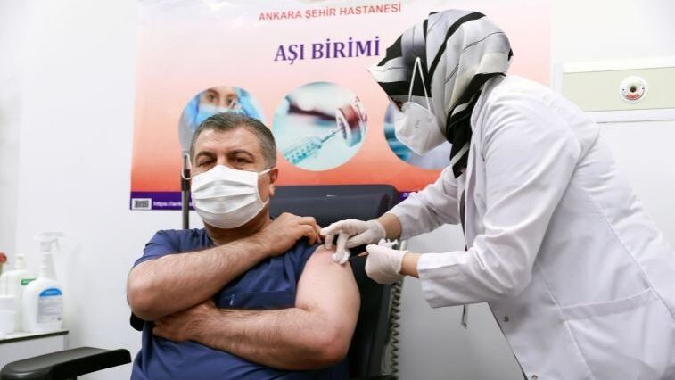 Turkish Health Minister Fahrettin Koca receives a shot of Sinovac's CoronaVac coronavirus disease (COVID-19) vaccine at Ankara City Hospital in Ankara, Turkey