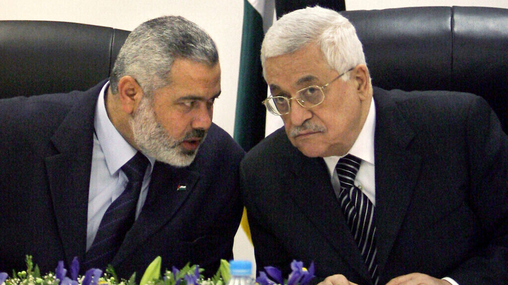 Palestinian Authority President Mahmoud Abbas, right, and then Palestinian Prime Minister Ismail Haniyeh of Hamas, left, 