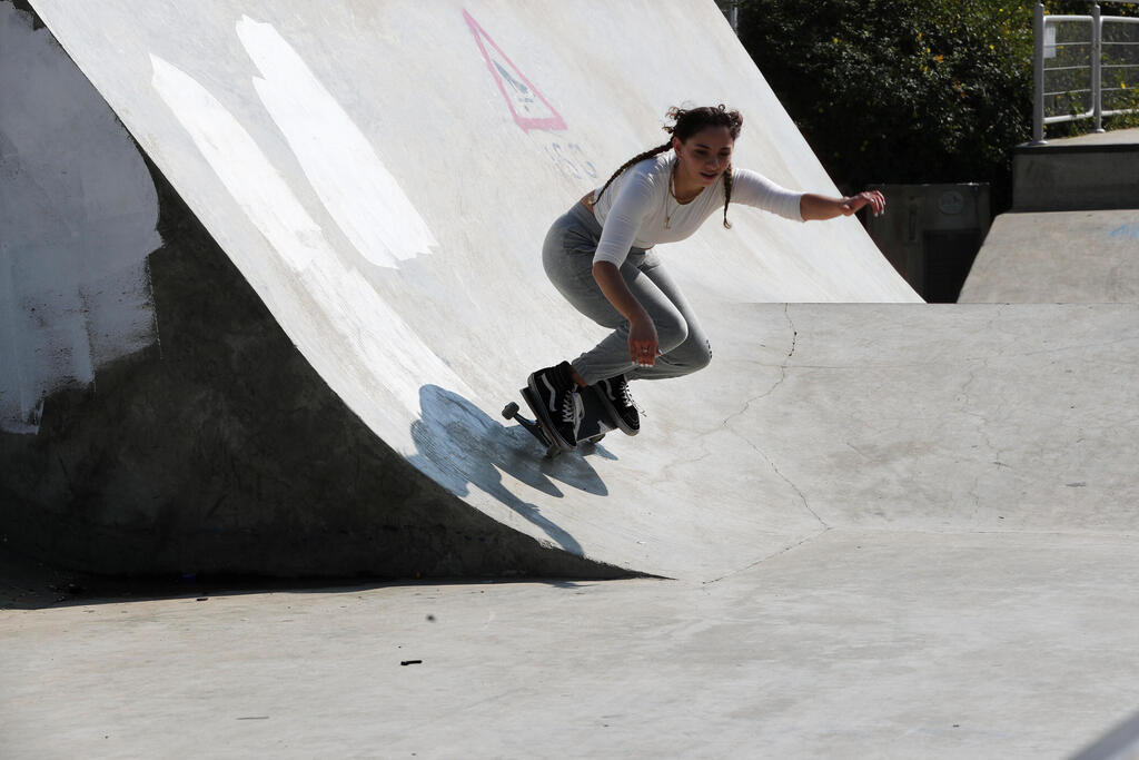 A Palestinian youth skateboards as Israel partially lifts its third national lockdown to fight the coronavirus disease (COVID-19) crisis, at a skate park in Jerusalem 
