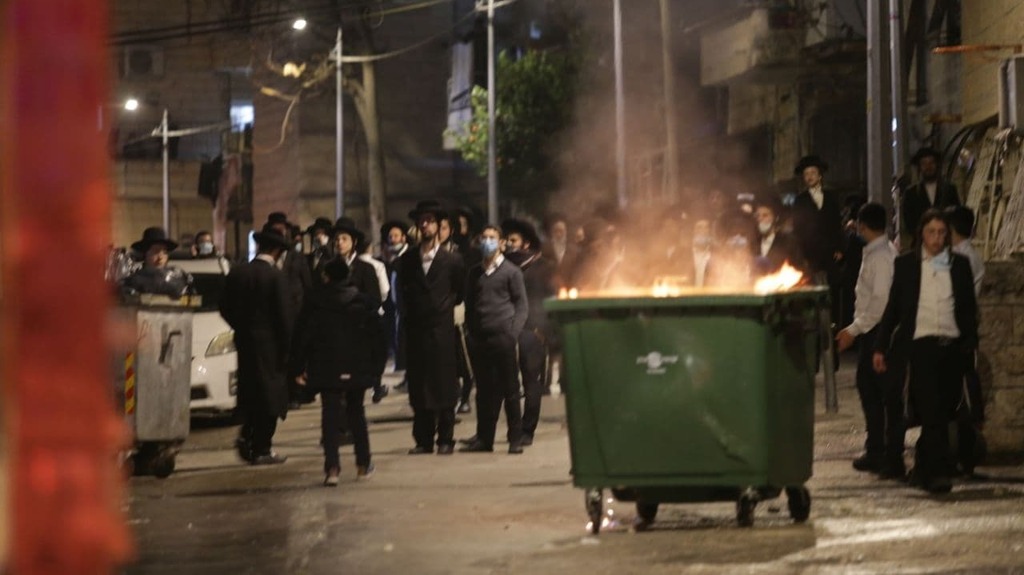 Haredi clash with police over virus curbs 