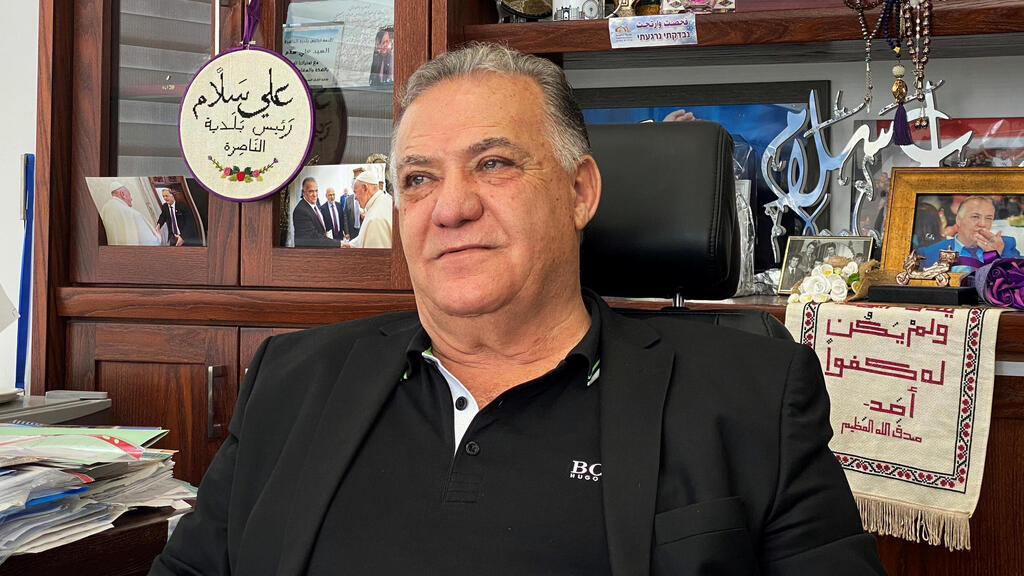 Ali Salam, mayor of Nazareth sits in his office 