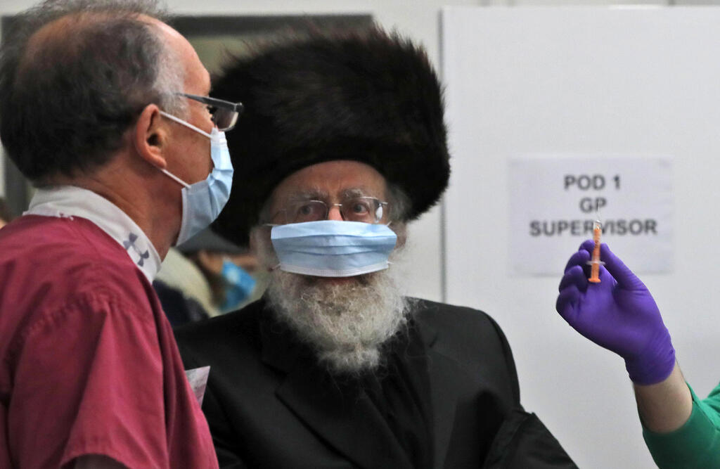an event to encourage vaccine uptake in Britain's Haredi Orthodox Jewish community in Centre London 