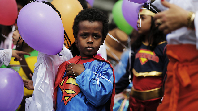 A child dressed as Superman celebrates a previous Purim in Tel Aviv 