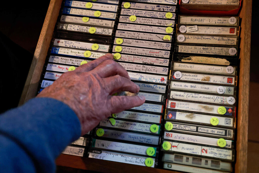 Bailey shows his collection of audio tape recordings of interviews with members of the Bedouin community at his home in Jerusalem