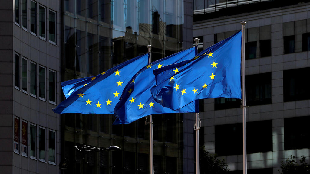  European Union flags flutter outside the European Commission headquarters in Brussels,