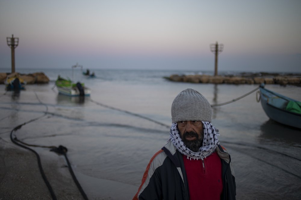 A local fisherman who goes by the name Jumbo returns from a fishing trip on the Mediterranean Sea, in the Israeli Arab village of Jisr al-Zarqa 
