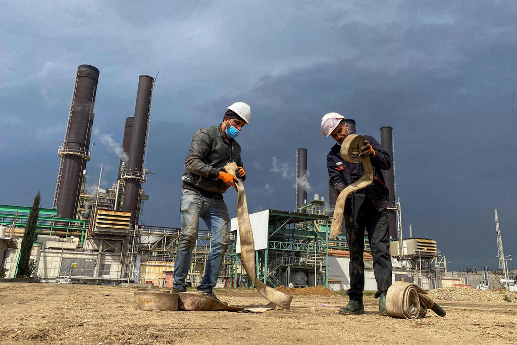 Workers are seen at Gaza's lone power plant, in the central Gaza Strip 
